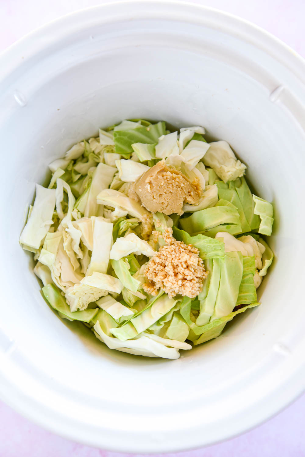 cabbage, miso paste and garlic in slow cooker