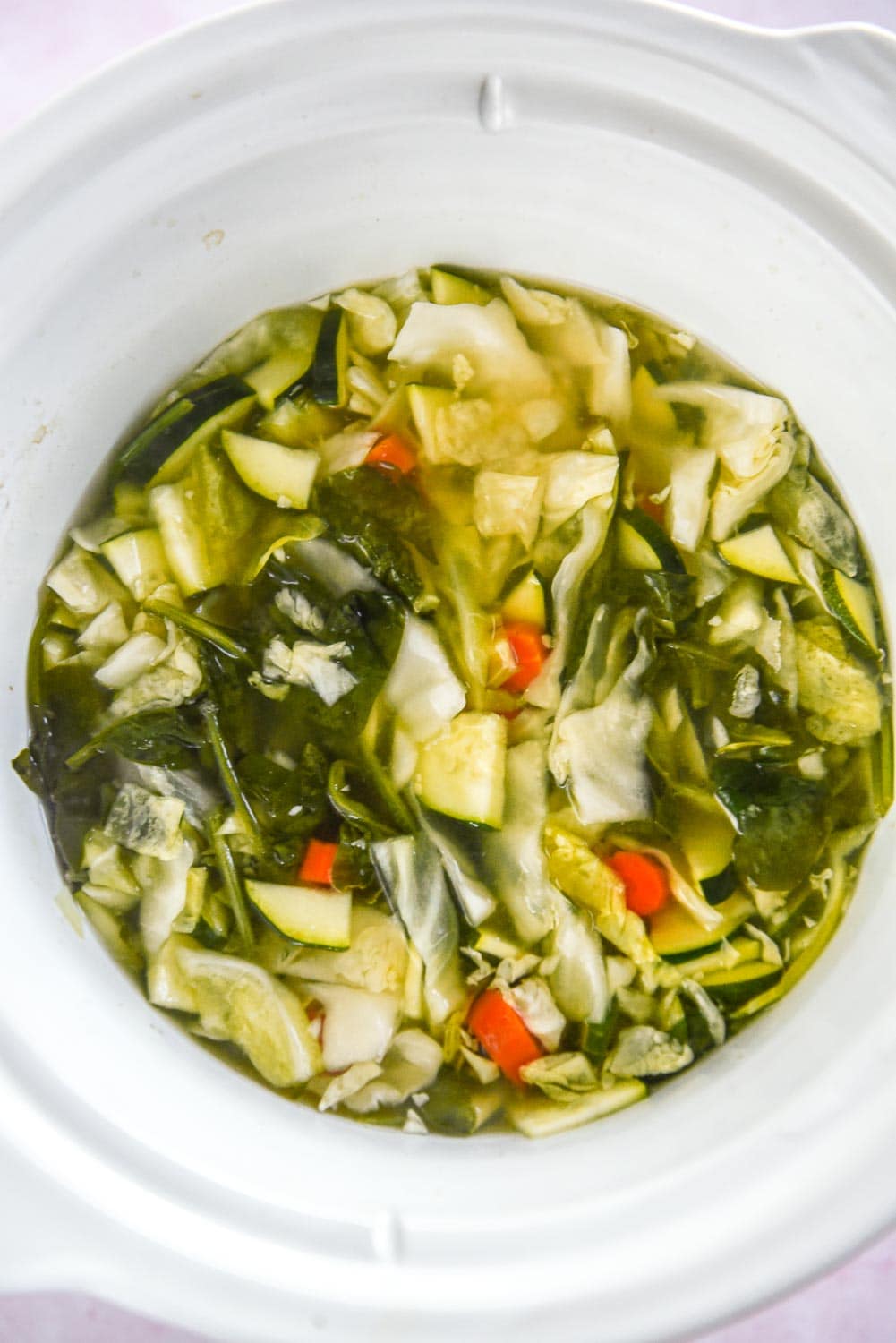 round white slow cooker with miso veggie soup