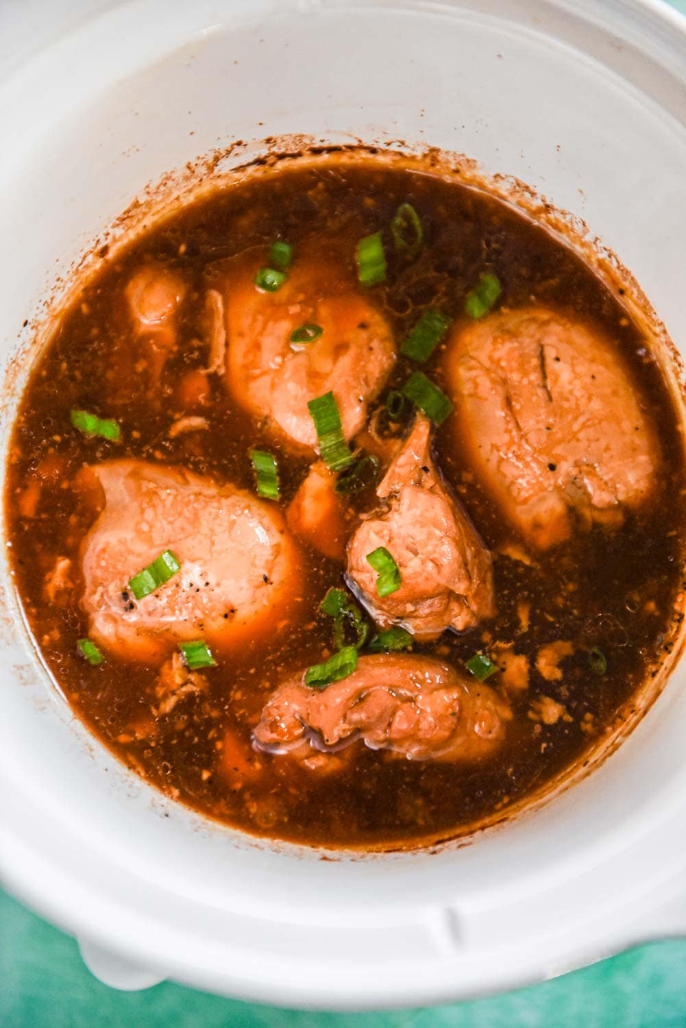 Slow cooker with adobo chicken thighs