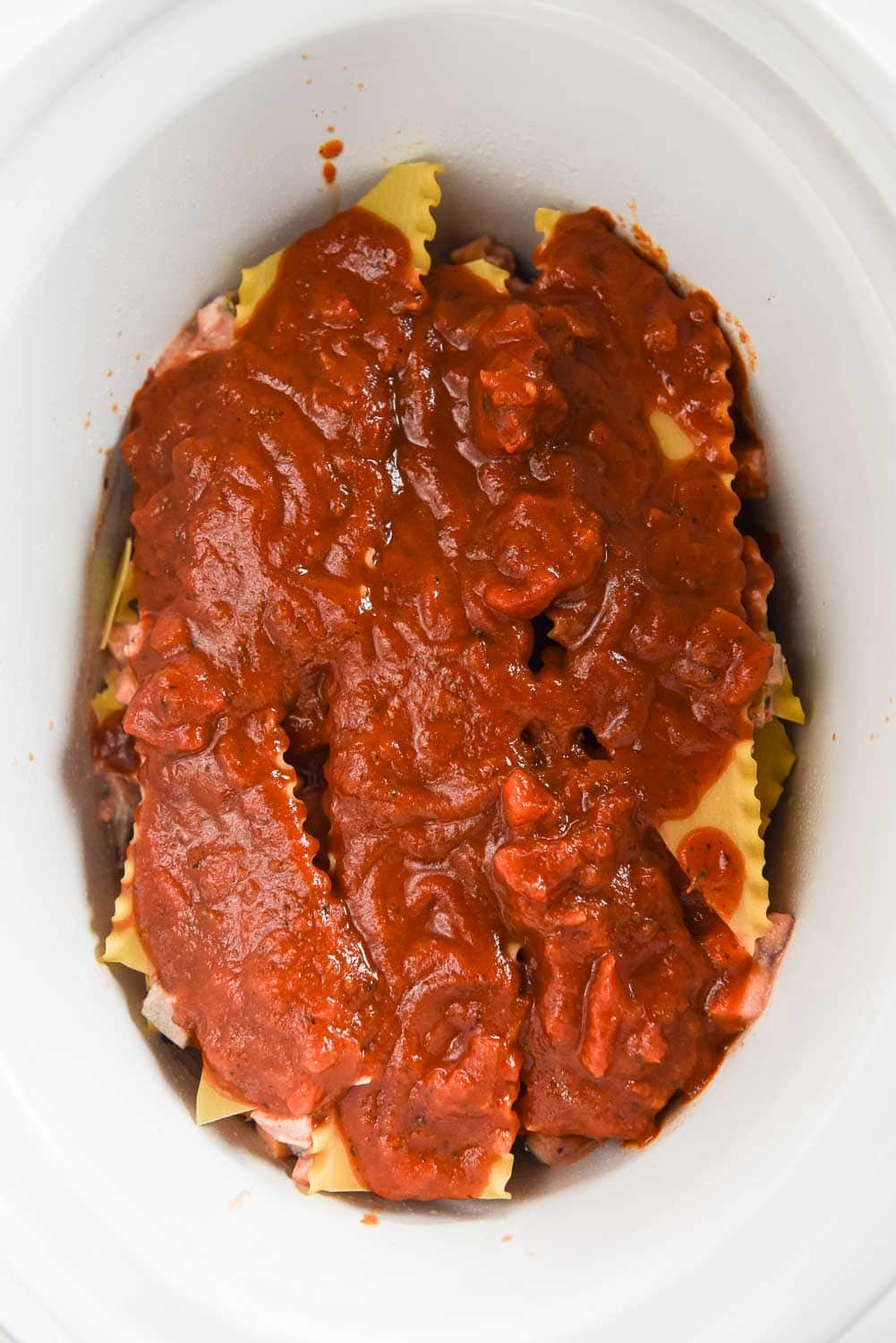 filing, noodles and pasta sauce in slow cooker