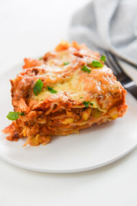 slice of veggie lasagna on white plate
