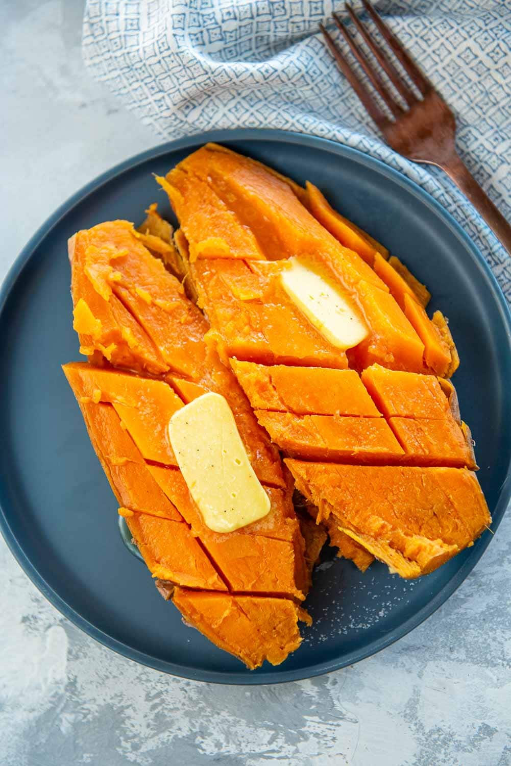 sweet potatoes cut up with butter on top