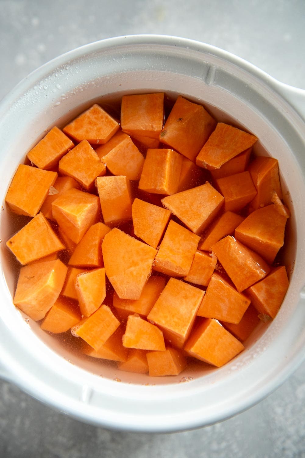 cubed sweet potatoes in slow cooker