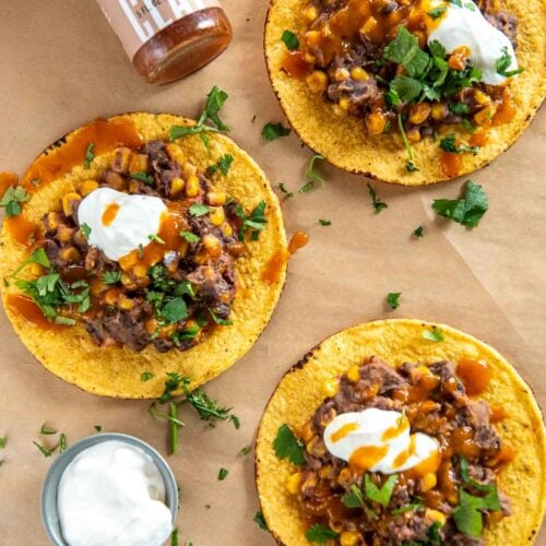 Slow Cooker Black Bean Corn and Basil Tostadas with a habanero hot sauce on side