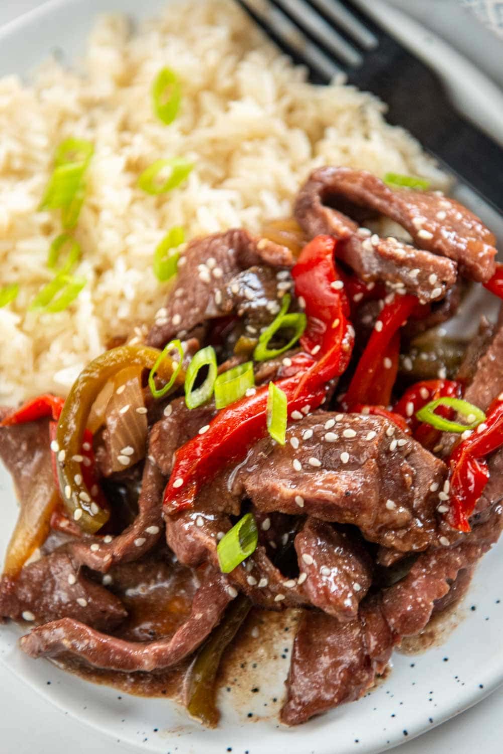 close up of slow cooker pepper steak served on plate