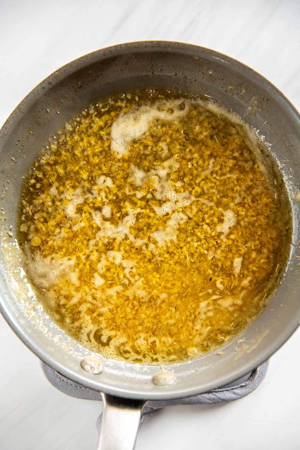 Seasoned butter mixture in frying pan