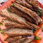 Beer Glazed Brisket In The Slow Cooker served on orange plate