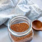 Variety of spices and seasonings mixed together in clear mason jar