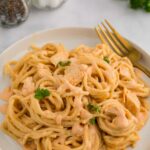 Plate of linguine pasta with buffalo chicken sauce