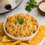 Slow Cooker Mexican Street Corn Dip served in a large bowl with tortilla chips