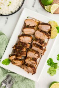 sliced Easy Slow Cooker Pork Roast on plate