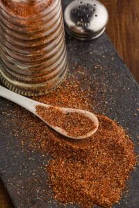 Southwest Spice Blend spilled on counter with spoonful of the seasoning laid on top