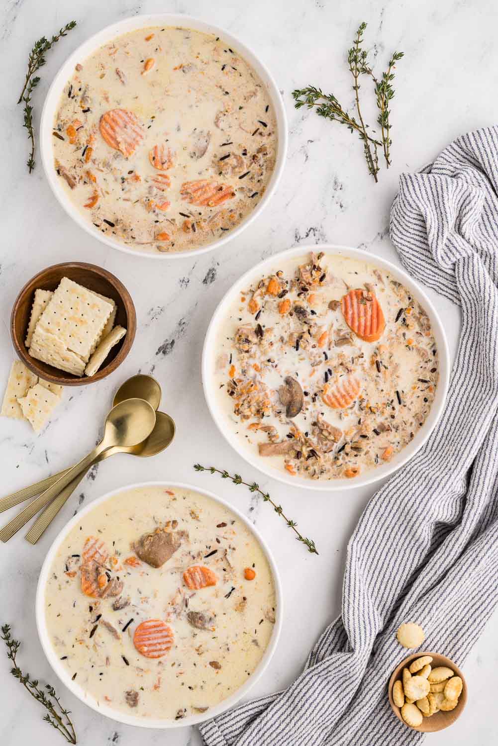 3 bowls of Slow Cooker Chicken and Wild Rice Soup served