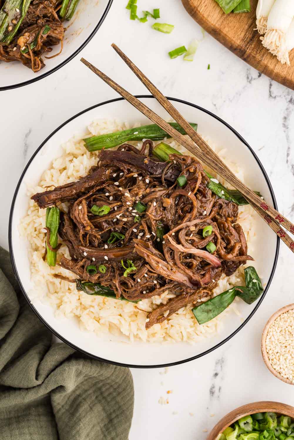 Rice and shredded Mongolian beef, garnished with freshly sliced green served on a bed of rice