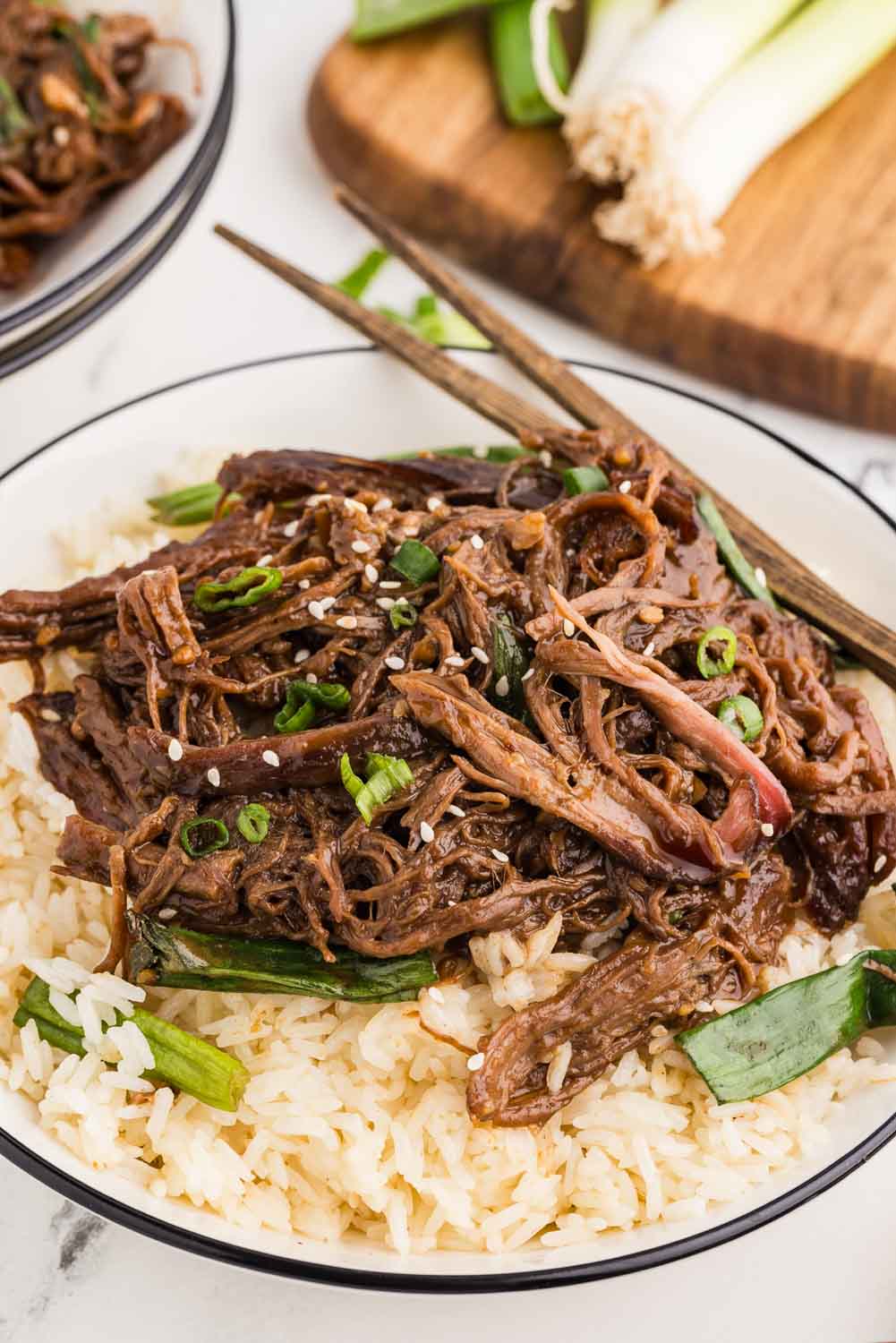 Rice and shredded Mongolian beef, garnished with freshly sliced green served on a bed of rice