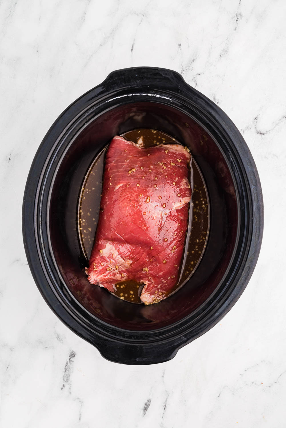 cornstarch and soy sauce mixture pour over flank steak in slow cooker