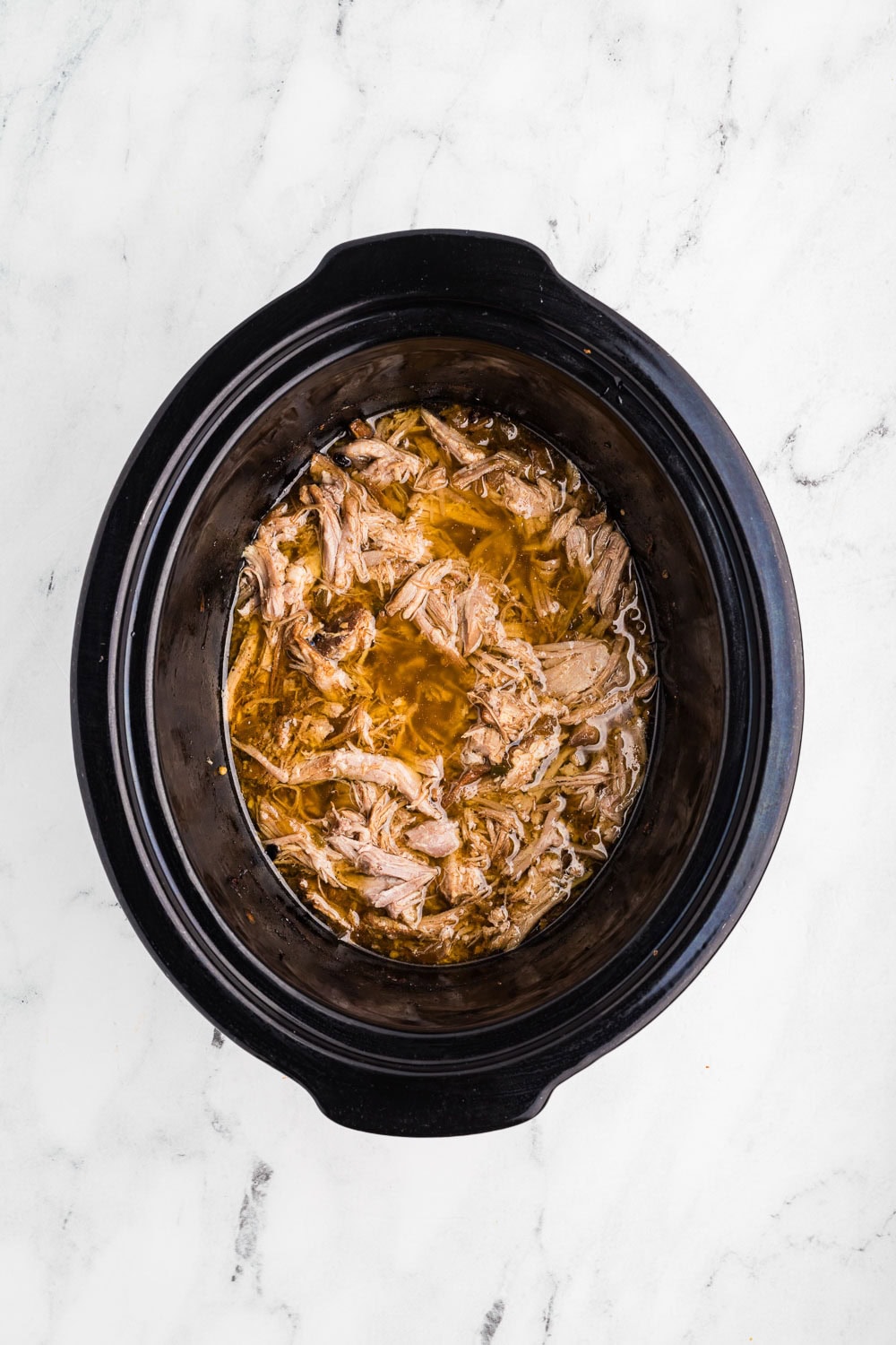 Slow Cooker Carnitas being cooked in slow cooker