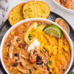 Slow Cooker Creamy Chicken Enchilada Soup served and garnished