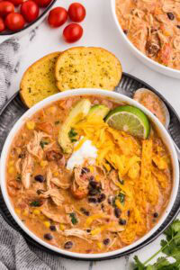 Slow Cooker Creamy Chicken Enchilada Soup served and garnished