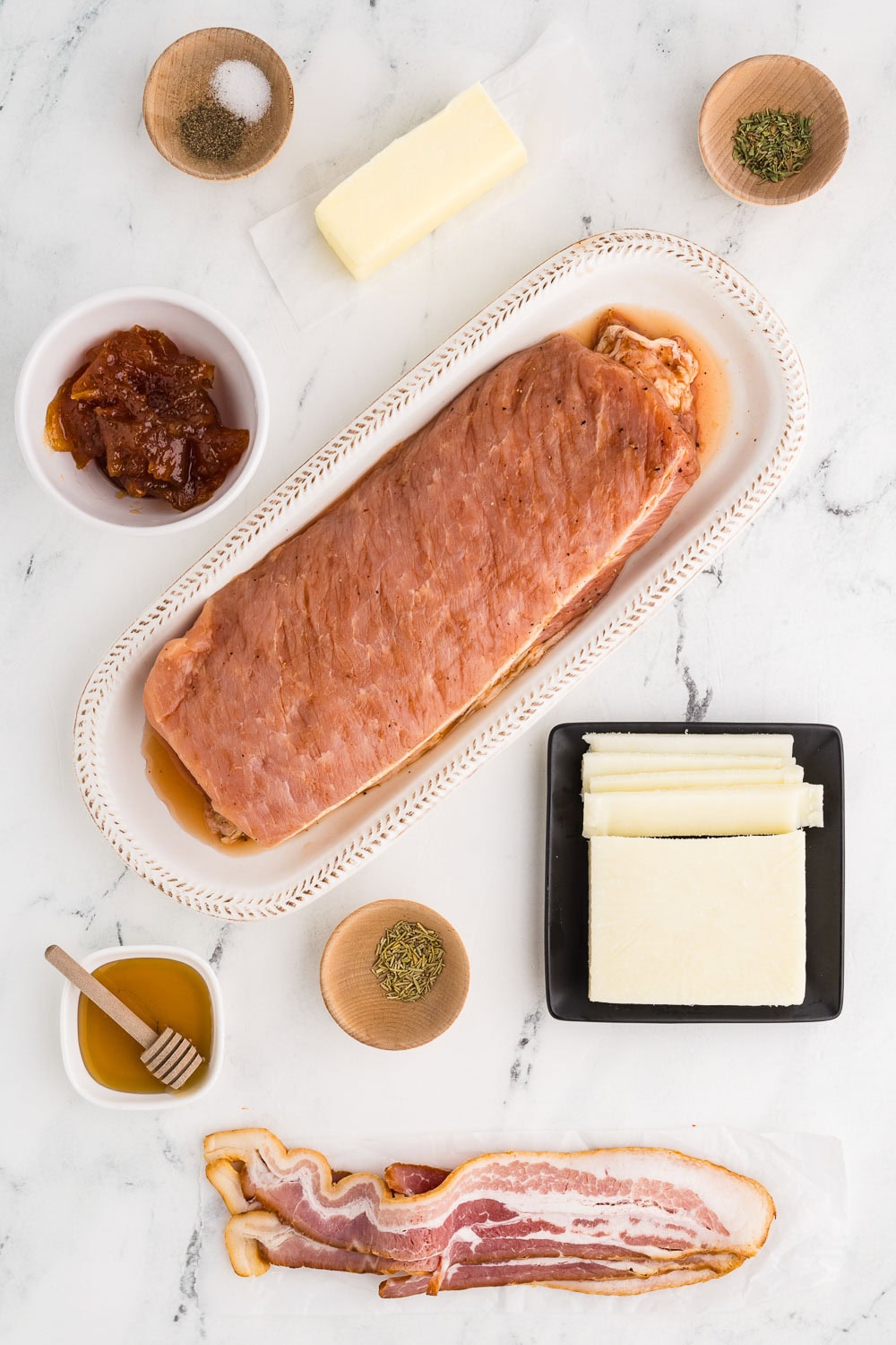 Counter with ingredients like 1 1/2 pounds pork tenderloin 3 strips bacon cooked crispy 4 ounces goat cheese sliced or crumbled 1 tablespoon honey 1/2 teaspoon dried thyme 1/4 teaspoon salt 1/8 teaspoon pepper Browned Butter sauce: 6 tablespoons butter 1/2 cup apricot preserves 1/2 teaspoon dried sage 1/2 teaspoon salt