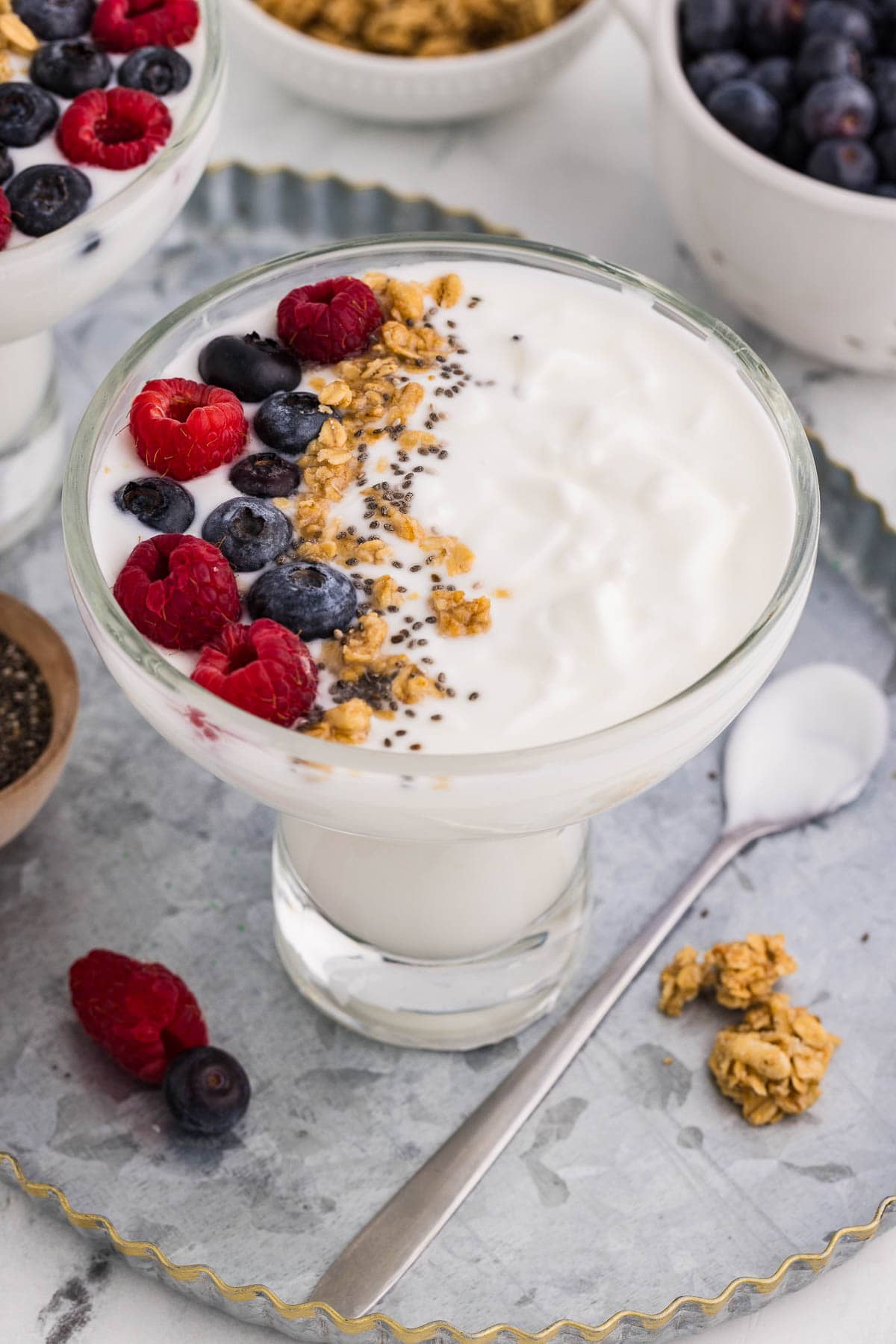 Homemade Yogurt served and garnished with berries and granola