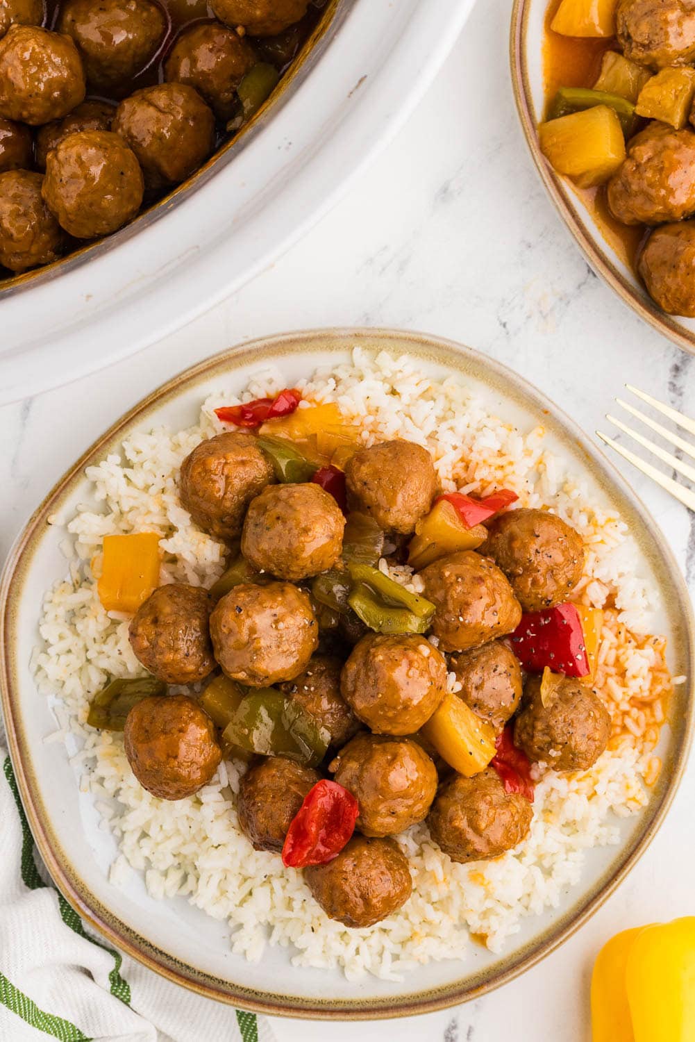 Slow Cooker Sweet and Sour Meatballs served on bed of rice