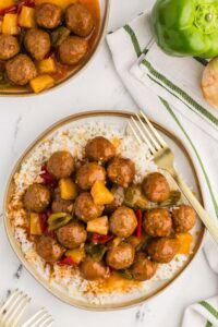 Slow Cooker Sweet and Sour Meatballs served on a bed of rice