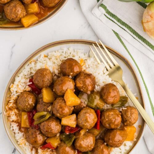 Slow Cooker Sweet and Sour Meatballs served on a bed of rice