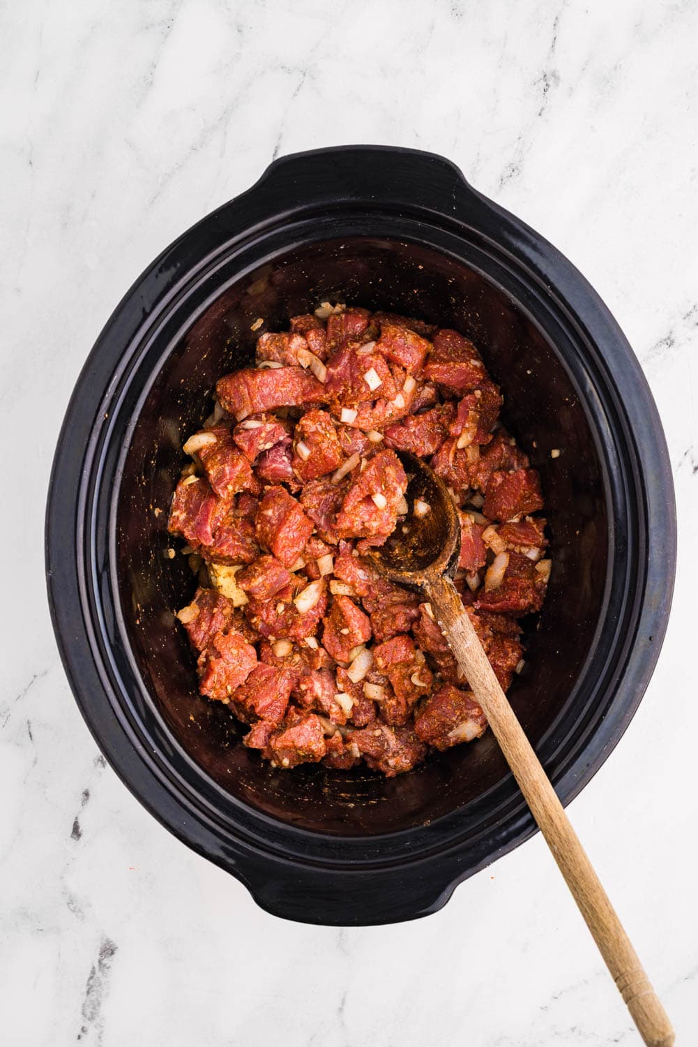 All ingredients2 pound beef or bison stew meat 2 teaspoons flour (can be gluten-free) 2 tablespoons pot roast seasoning or steak seasoning (homemade or store bought) 1 small sweet onion, chopped 1 tablespoon jarred minced garlic 2 tablespoons butter ½ cup beef broth mixed together with wooden spoon in slow cooker