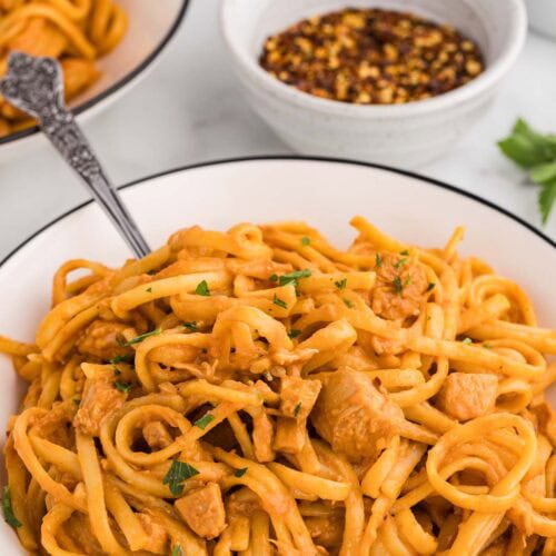 Slow cooker firecracker Chicken served and garnished