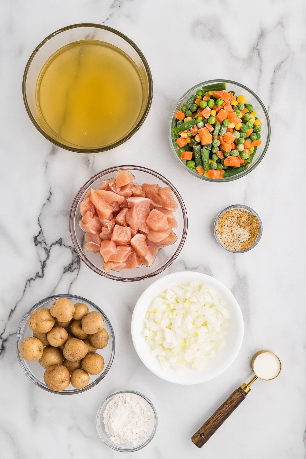 3/4 pound boneless skinless breasts chopped into bite sized pieces 1 1/2 cup frozen mixed veggies 4 oz baby potatoes diced 1 small yellow onion diced 1 tablespoon herb and garlic seasoning 2 tablespoons tapioca flour 1 1/2 cups chicken broth 1 tablespoon heavy cream on counter ready to prepare recipe