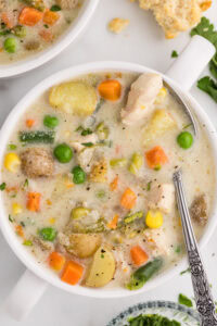Slow Cooker Chicken Pot Pie Soup bowl served with a spoon
