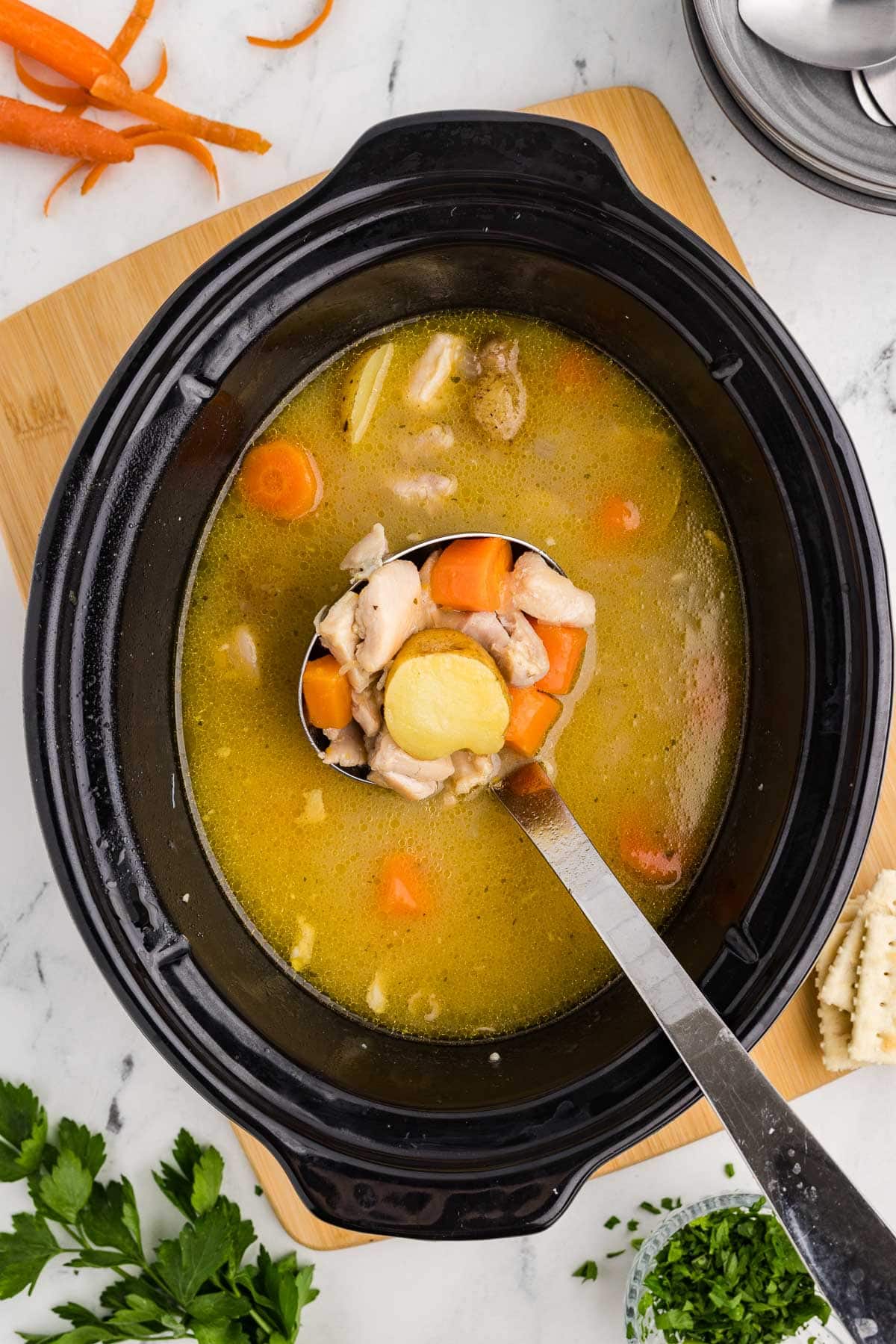 Bowl of ladle Slow Cooker Chicken Stew