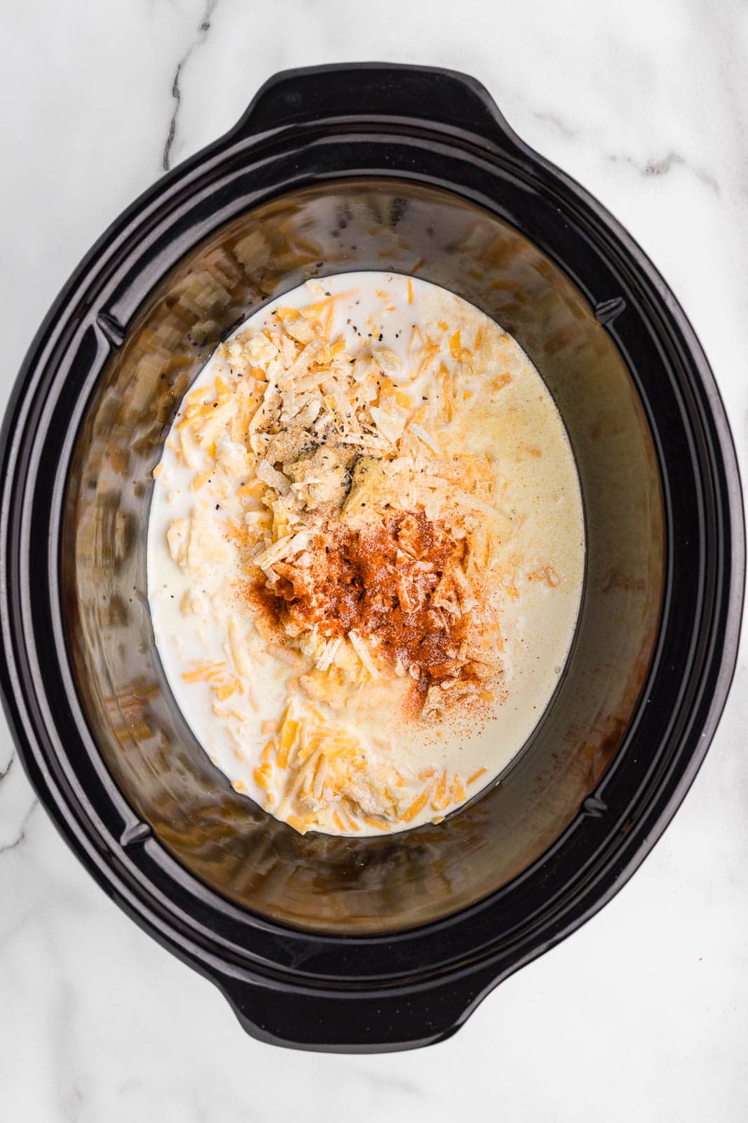 black slow cooker with all ingredients