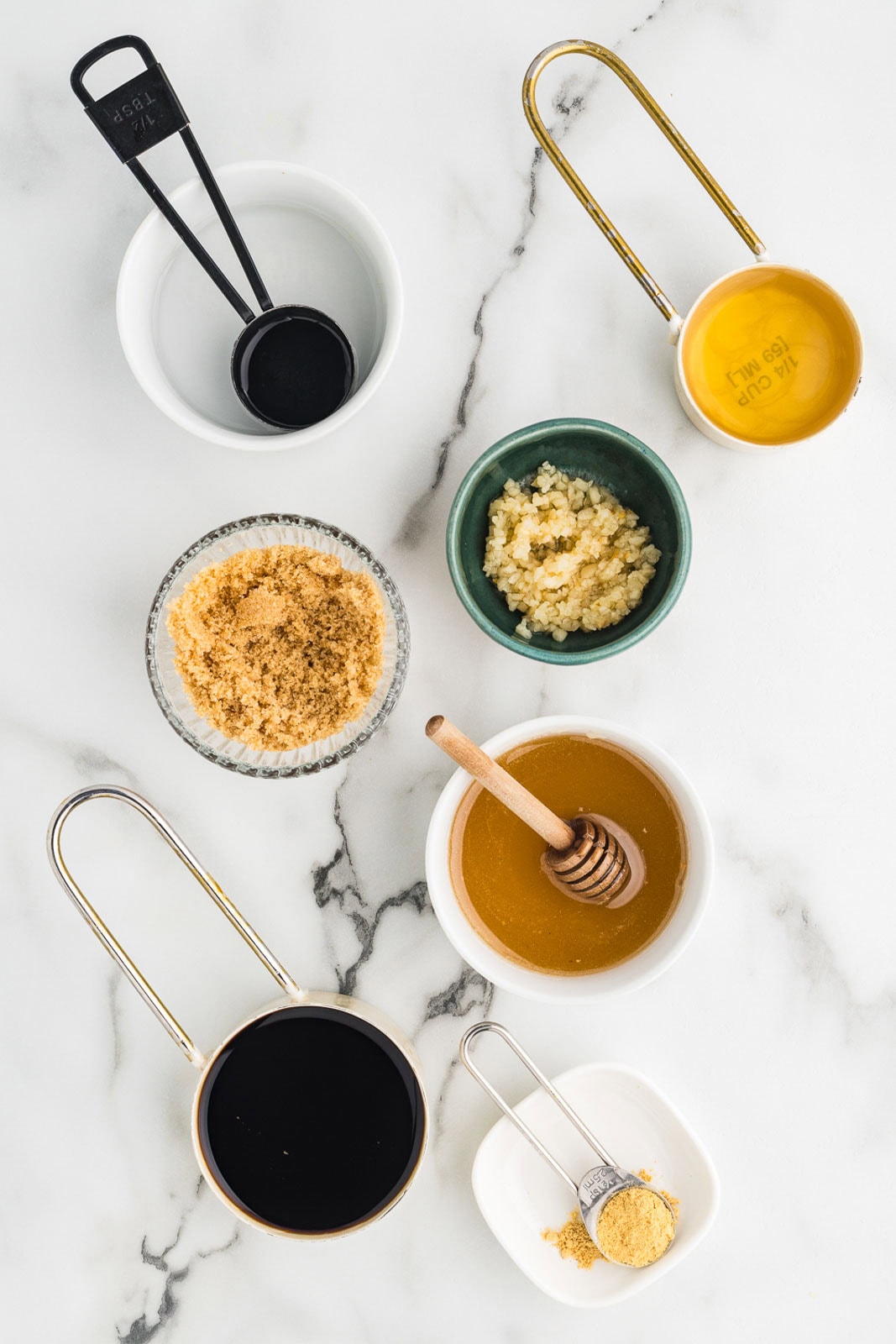 ingredients in containers to include soy sauce, honey, brown sugar, chicken broth, rice vinegar, minced garlic and ground ginger