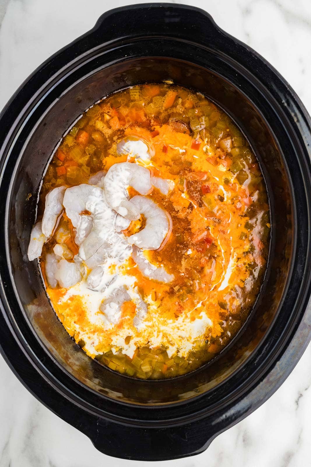 black slow cooker with all ingredients