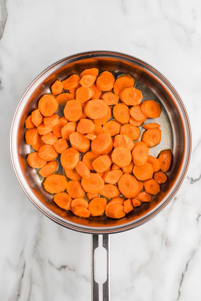 overhead view of skillet with cut up carrots