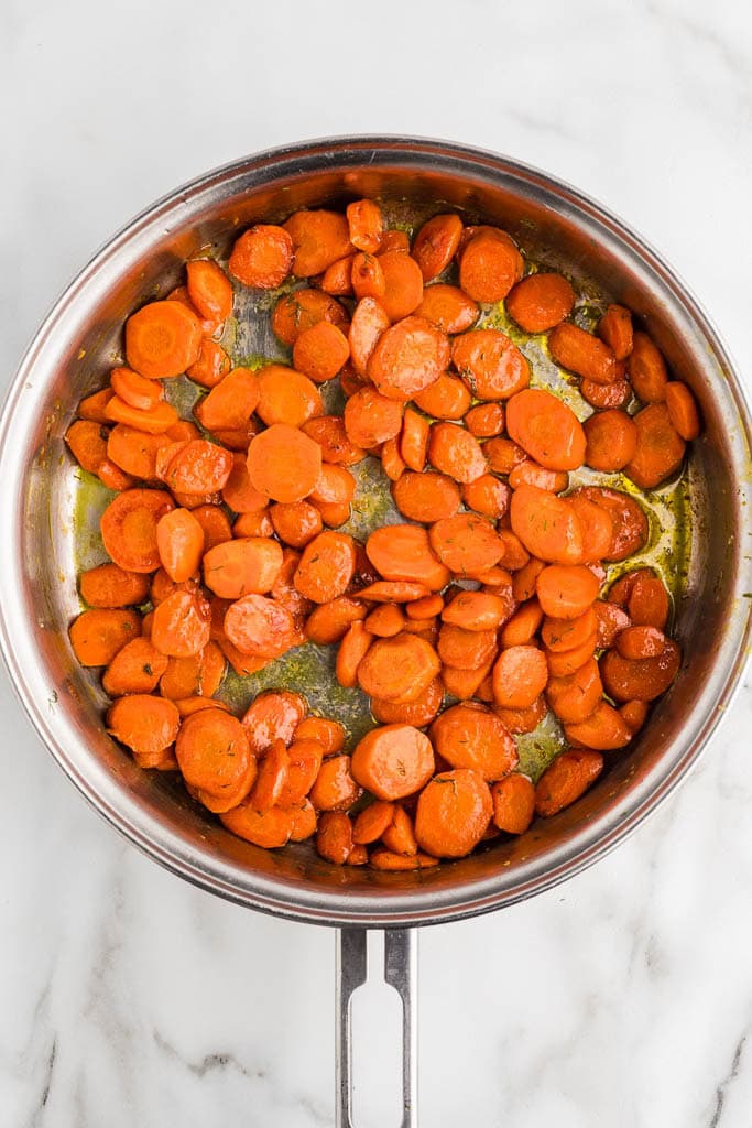 overhead view of skillet with sauteed carrots with honey