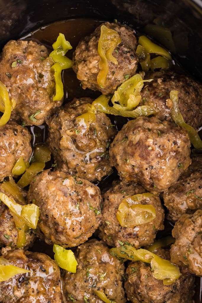 closeup view of meatballs in black slow cooker